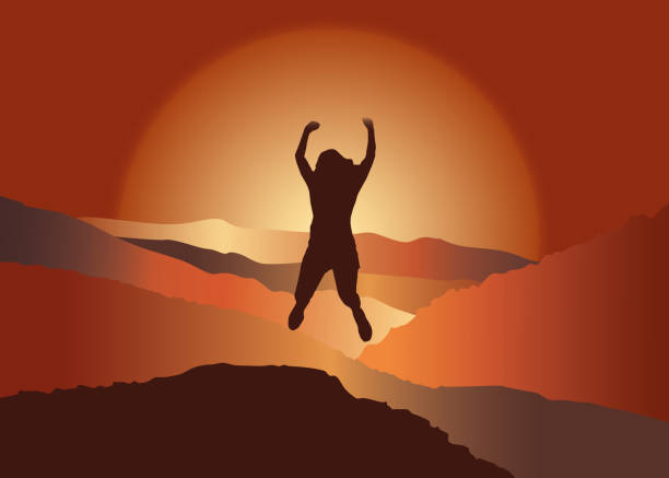 istock Happy girl with raised hans jumping on the top of mountain. 902242368