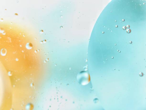 abstract colorful backdrop with oil drops on water surface. possible themes for the application - cosmetic advertising, space, fantasy