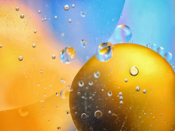 istock abstract colorful backdrop with oil drops on water surface. possible themes for the application - cosmetic advertising, space, fantasy 902251006