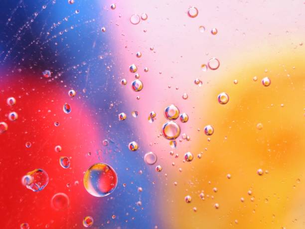 abstract colorful backdrop with oil drops on water surface. possible themes for the application - cosmetic advertising, space, fantasy