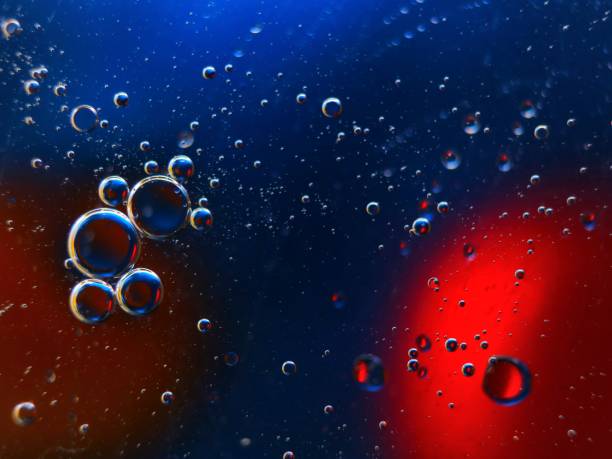abstract colorful backdrop with oil drops on water surface. possible themes for the application - cosmetic advertising, space, fantasy