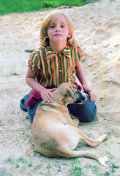istock Girl from the seventies with her dog 902251304