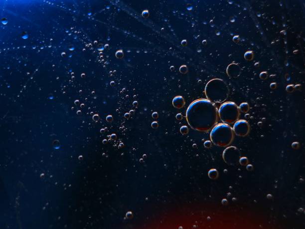 istock abstract colorful backdrop with oil drops on water surface. possible themes for the application - cosmetic advertising, space, fantasy 902251334