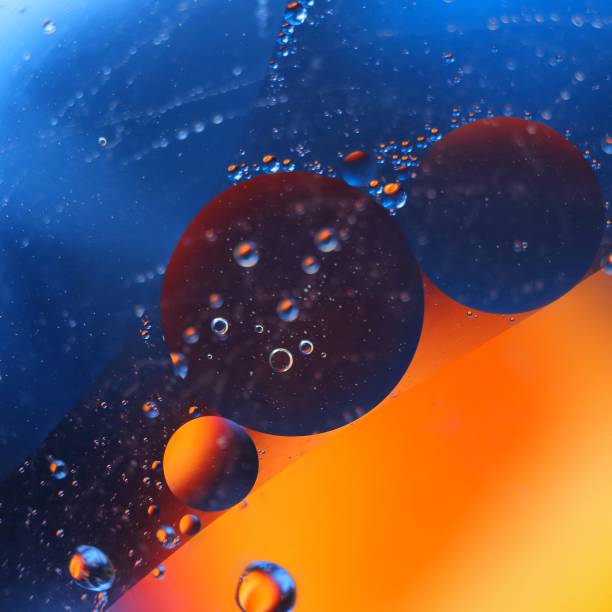 abstract colorful backdrop with oil drops on water surface. possible themes for the application - cosmetic advertising, space, fantasy