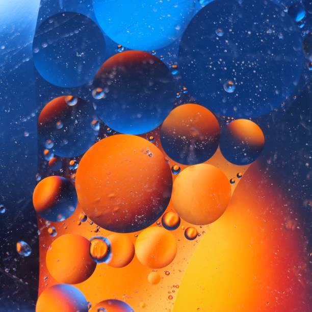 istock abstract colorful backdrop with oil drops on water surface. possible themes for the application - cosmetic advertising, space, fantasy 902251452