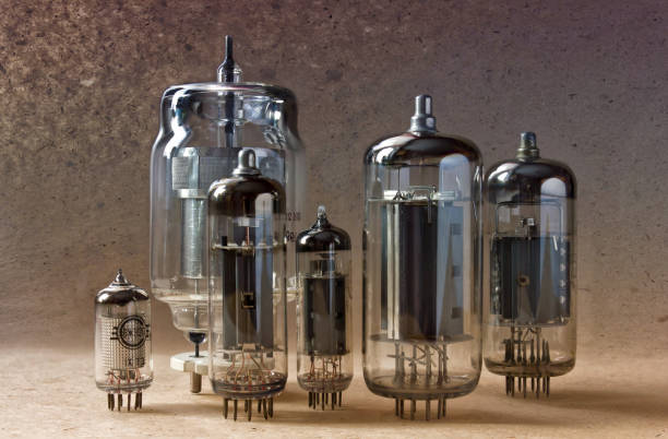 istock electronic background with vintage vacuum tubes on kraft paper. 902251820