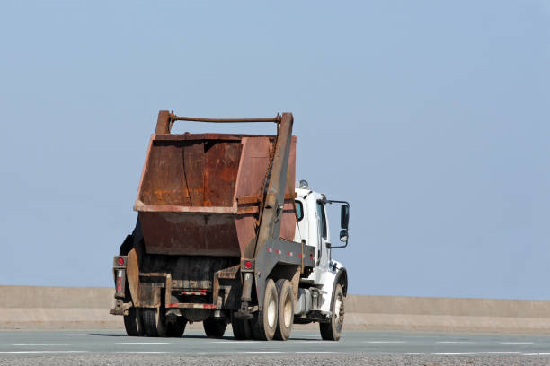 istock Truck On Highway Carrying Industrial Waste Bin 902260710