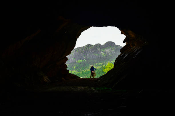 istock interior of the cave discovery with adventure and motorcycle 902264516
