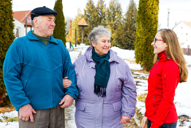 istock Elderly couple and young caregiver 902264528