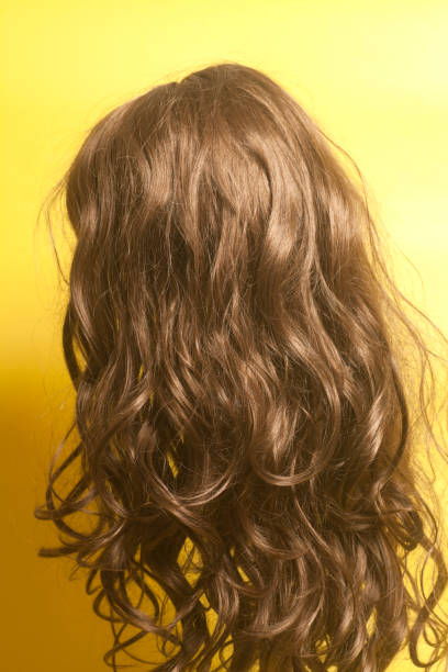 istock Woman long curly hairs wig 902265280