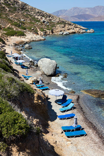 istock Kalymnos - Telendos island, small beach with sunbathing beds. Dodecanese Islands 902267524