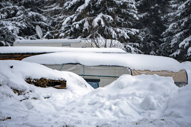 istock rv trailer caravan roulotte covered by white snow 902278970