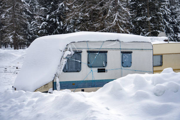 istock rv trailer caravan roulotte covered by white snow 902279094