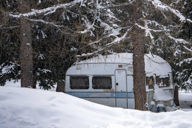 istock rv trailer caravan roulotte covered by white snow 902279248