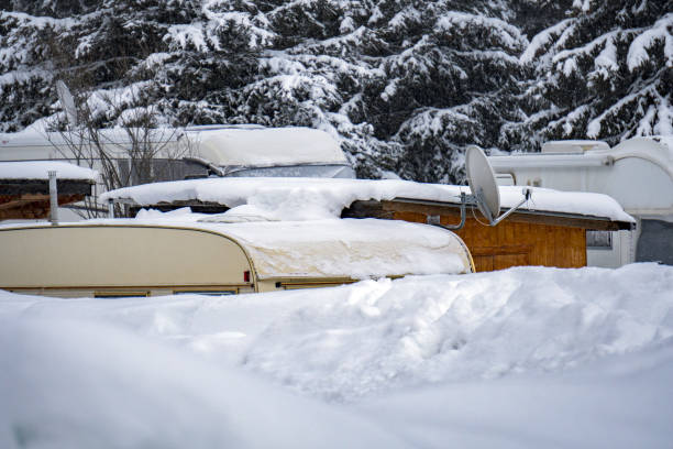istock rv trailer caravan roulotte covered by white snow 902279302