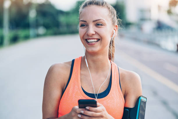 istock Happy athlete listening music 902286318