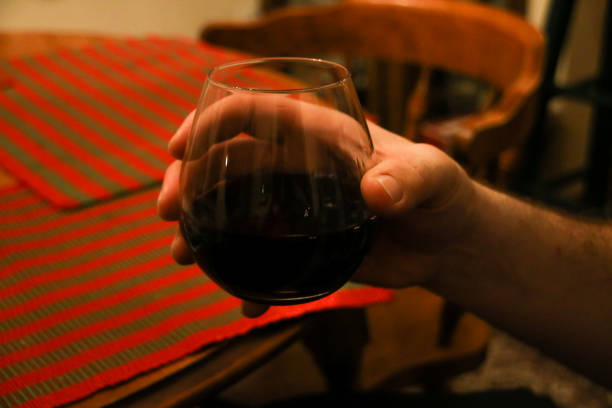 Older Man's Hand with Brandy Glass
