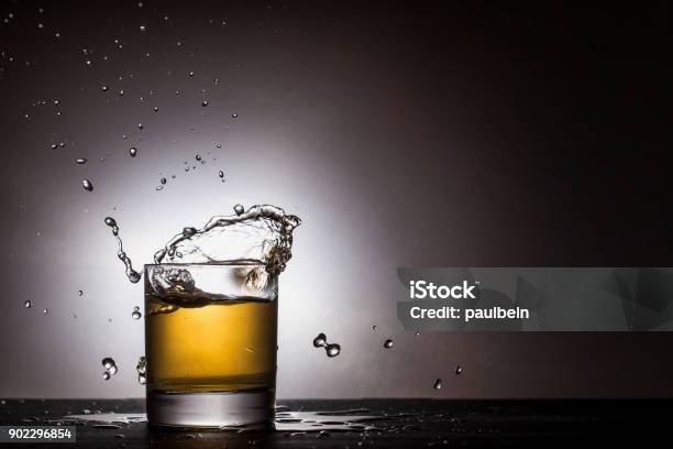 Alcohol Splash Stock Photo - Download Image Now - Alcohol - Drink, Amber, Black Color