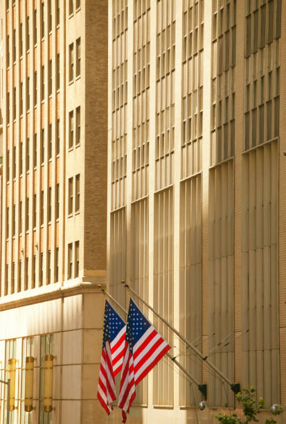istock American Flags Hanging From Skyscrapers 902303470