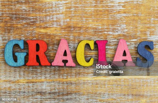Foto de Gracias Escrito Com Letras Coloridas Na Superfície De Madeira Rústica e mais fotos de stock de Thank You - iStock