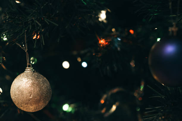 istock holiday decorations hang on a Christmas tree 902307300
