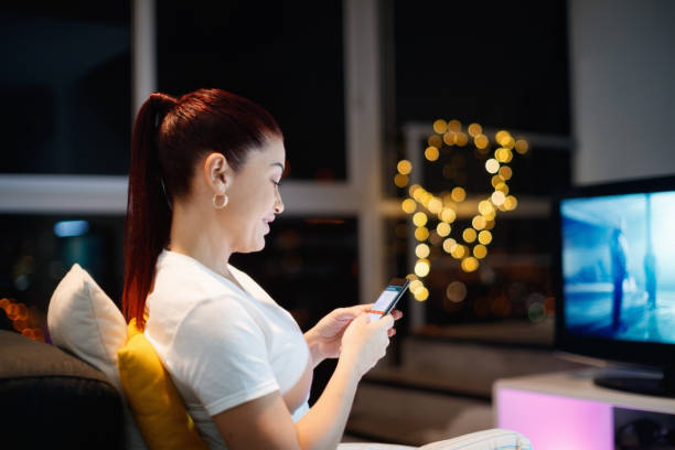 istock Hispanic Woman Sends Text Message Chats On Mobile Phone 902325924