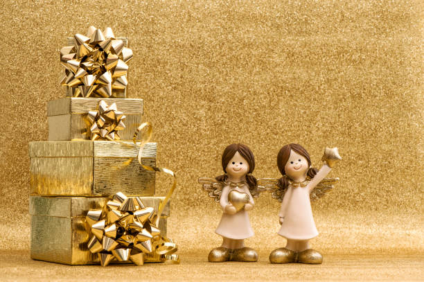 istock Gift box with ribbon Little angels Holidays decoration 902332628