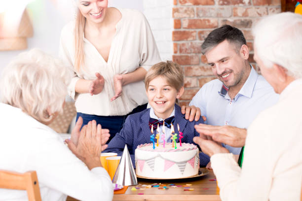 istock Family clapping their hands at a party 902338236