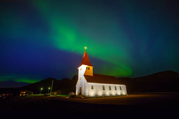 istock The Northern Light Aurora borealis over Vik Church 902340760