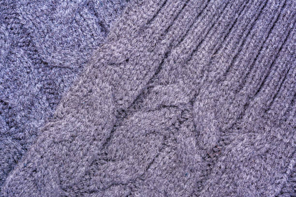 istock texture of the surface of a knitted woolen fabric with a pigtail pattern, abstract background 902344530