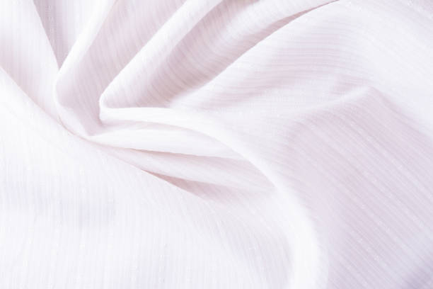 istock texture of white cotton fabric with arbitrary bends and wave, abstract background 902345008