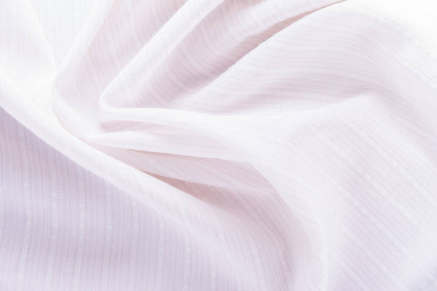 istock texture of white cotton fabric with arbitrary bends and wave, abstract background 902347128