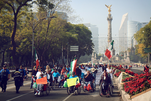 Mexico City, Mexico - December 3, 2017: Peaceful protesters participate in a march calling for the Mexican government to defend the rights of the handicapped community.