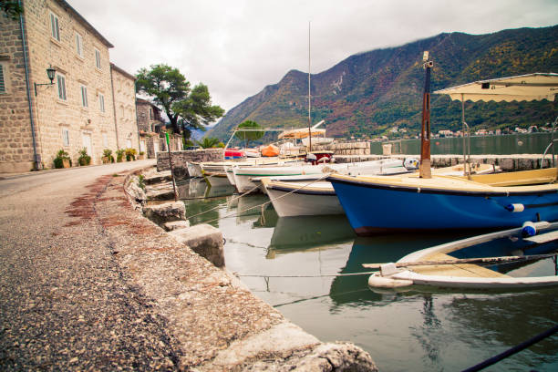istock Boats in a harbor in Perast Montenegro 902360322