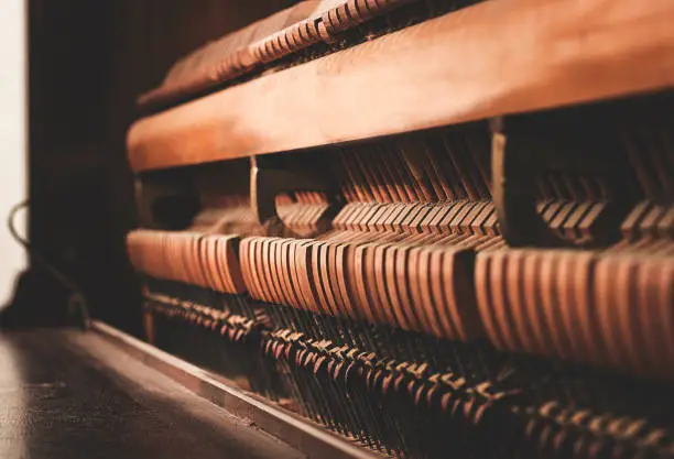 photo of the inside of a piano