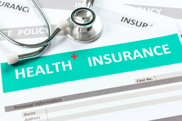 istock health insurance form with stethoscope in top view 902372284