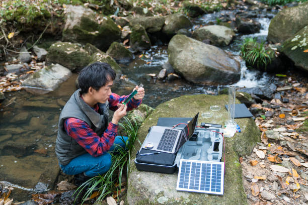 istock A scientist monitoring water quality from a solar powered field laboratory 902378206