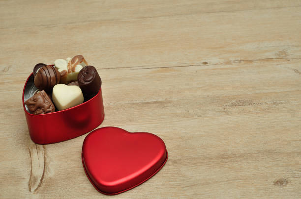 istock A heart shape tin filled with delicious small chocolates 902378280