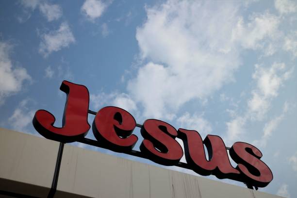 istock Jesus Sign on Cloudy Blue Sky 902387650