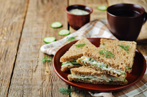 istock Cream cheese dill cucumber english tea sandwiches 902397406
