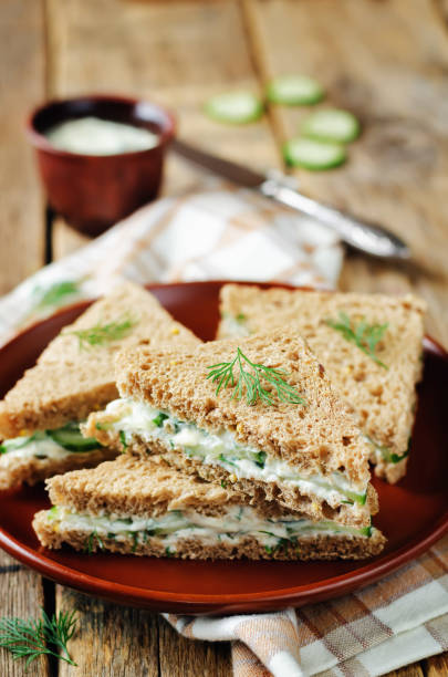 istock Cream cheese dill cucumber english tea sandwiches 902397410