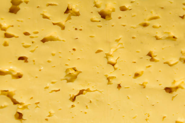 istock Texture of the sliced cheese for background 902407340