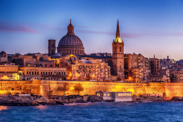 istock Valletta, Malta: skyline from Marsans Harbour at sunset 902418212