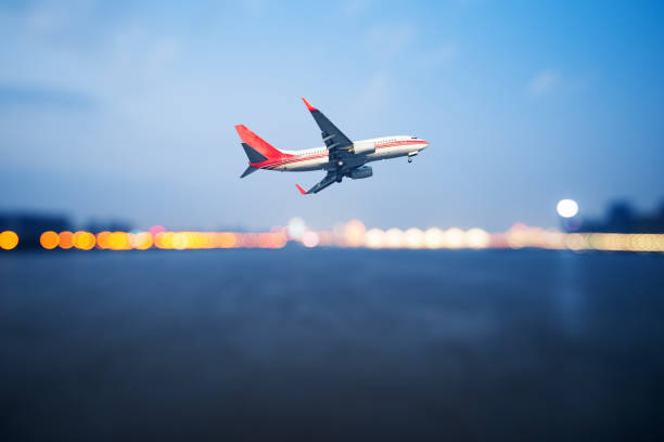 istock perspective view of jet airliner in flight with bokeh background 902420286