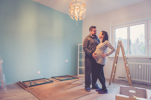 istock Pregnant couple in a new home 902425392