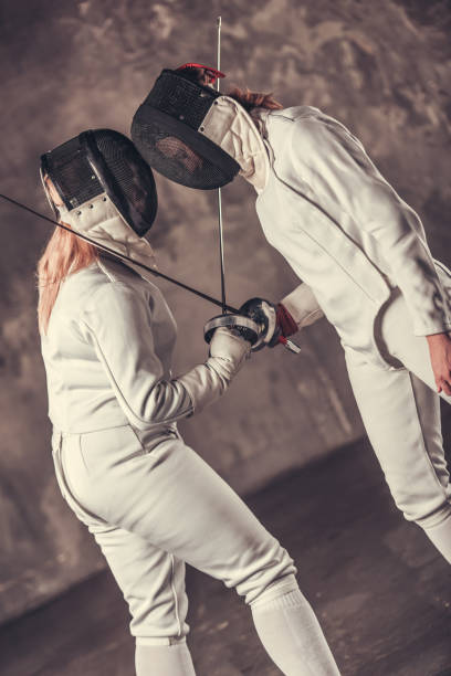 istock Two women fencing 902425722