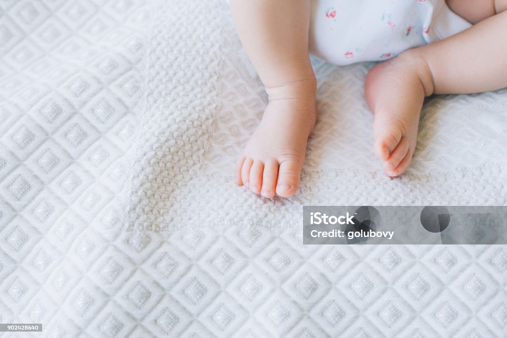 little newborn baby feet on white background little newborn baby feet on white background. mother's happiness. family values. free space concept. Baby - Human Age Stock Photo