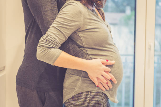 istock Pregnant couple in a new home 902429528