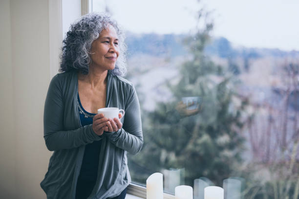 istock A Senior Woman Drinks Tea While Contemplating the Day Ahead 902441194