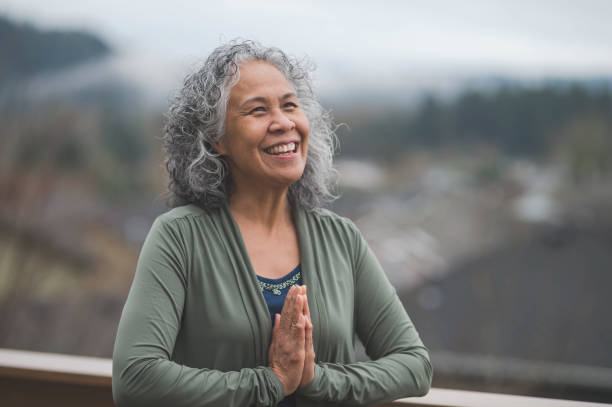 istock Hawaiian Woman Practicing Yoga Outside 902441214